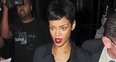 Rihanna wearing a black mini skirt in New York
