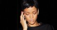Rihanna wearing a long black dress