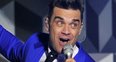 Robbie Williams live on stage at the BRIT Awards 2