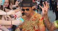 Bruno Mars is greeted by fans