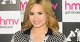 Demi Lovato attends alnum signing